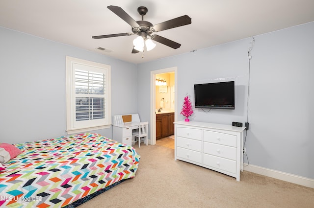 bedroom featuring baseboards, visible vents, a ceiling fan, and light colored carpet