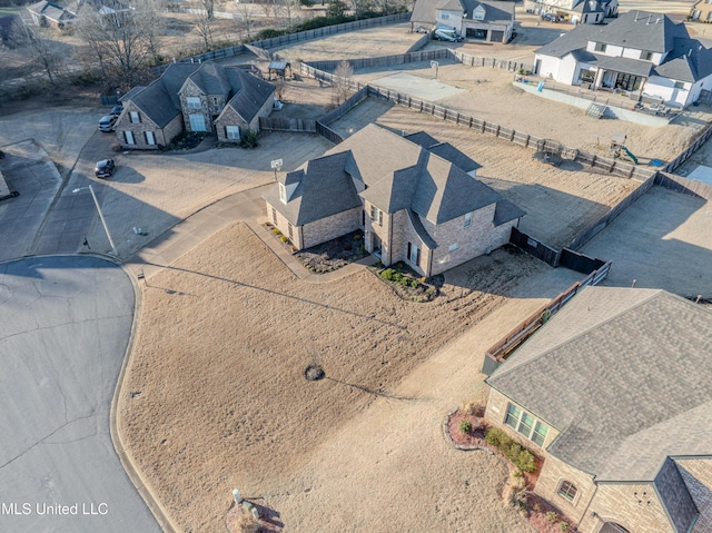 birds eye view of property with a residential view