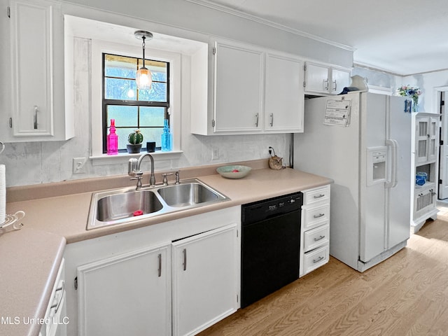 kitchen featuring dishwasher, light hardwood / wood-style flooring, sink, decorative light fixtures, and white cabinets