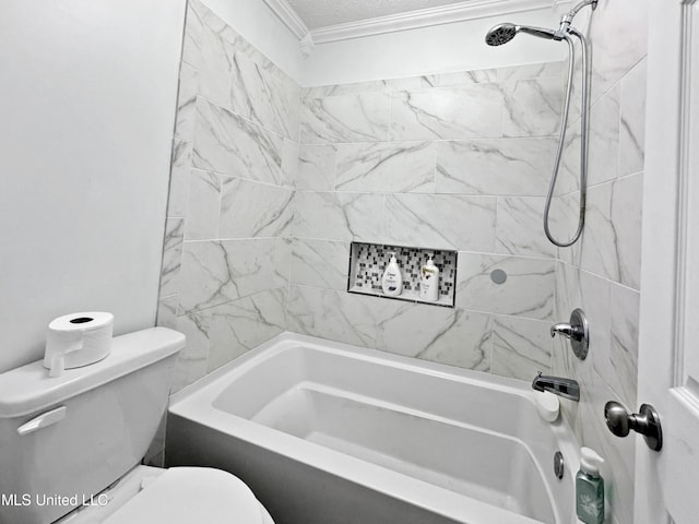 bathroom featuring toilet, ornamental molding, and tiled shower / bath