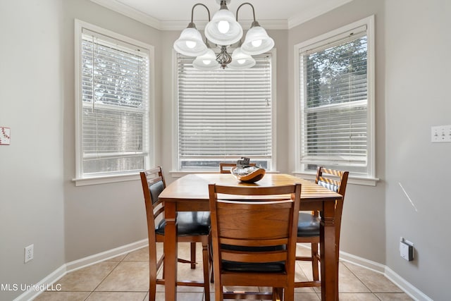 dining room with a healthy amount of sunlight, ornamental molding, and light tile patterned flooring