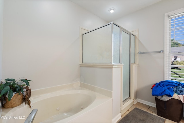 bathroom with shower with separate bathtub and tile patterned floors