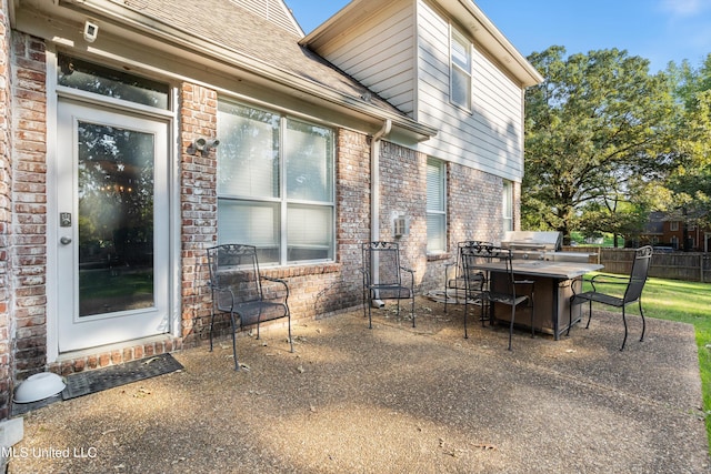 view of patio with a grill