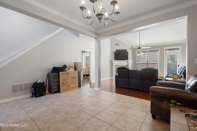 living room featuring crown molding, light tile patterned flooring, lofted ceiling, and ceiling fan with notable chandelier