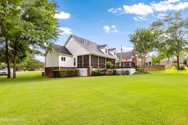 9194 Rosalie Cv, Olive Branch, MS 38654 - back of property featuring a sunroom, brick siding, and a yard