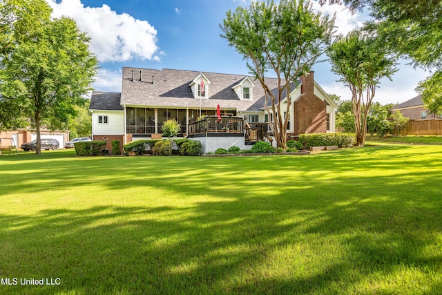 9194 Rosalie Cv, Olive Branch, MS 38654 - view of front of home with a sunroom, a front lawn, a chimney, and a deck