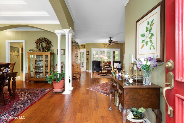 9194 Rosalie Cv, Olive Branch, MS 38654 - entrance foyer with arched walkways, a ceiling fan, wood finished floors, ornamental molding, and ornate columns