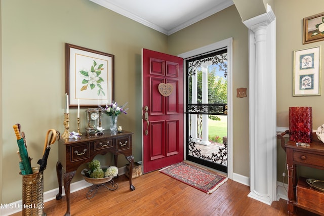 9194 Rosalie Cv, Olive Branch, MS 38654 - foyer with decorative columns, crown molding, and wood finished floors