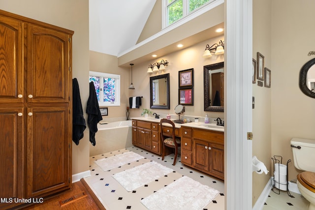 9194 Rosalie Cv, Olive Branch, MS 38654 - full bathroom featuring double vanity, a garden tub, and high vaulted ceiling