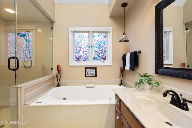 9194 Rosalie Cv, Olive Branch, MS 38654 - full bath with vanity, a shower stall, and a tub with jets