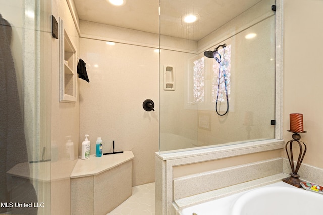 9194 Rosalie Cv, Olive Branch, MS 38654 - bathroom with walk in shower, a bath, and recessed lighting