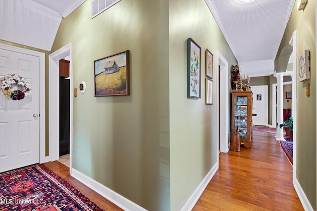 9194 Rosalie Cv, Olive Branch, MS 38654 - corridor with ornate columns, light wood-type flooring, and ornamental molding