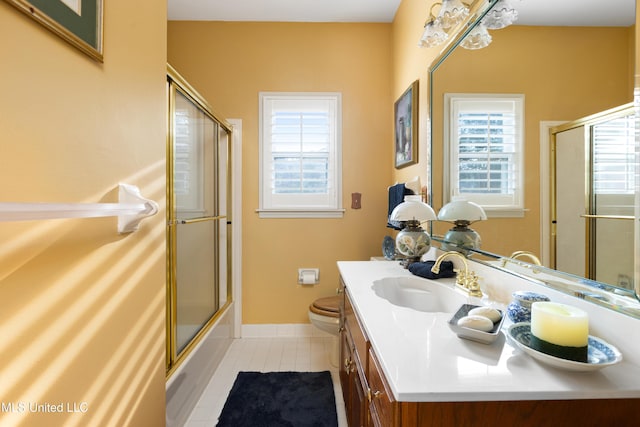 9194 Rosalie Cv, Olive Branch, MS 38654 - bathroom featuring vanity, tile patterned floors, and shower / bath combination with glass door