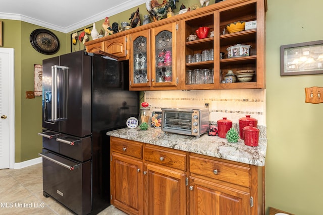 9194 Rosalie Cv, Olive Branch, MS 38654 - kitchen with black refrigerator with ice dispenser, crown molding, brown cabinets, glass insert cabinets, and light tile patterned floors