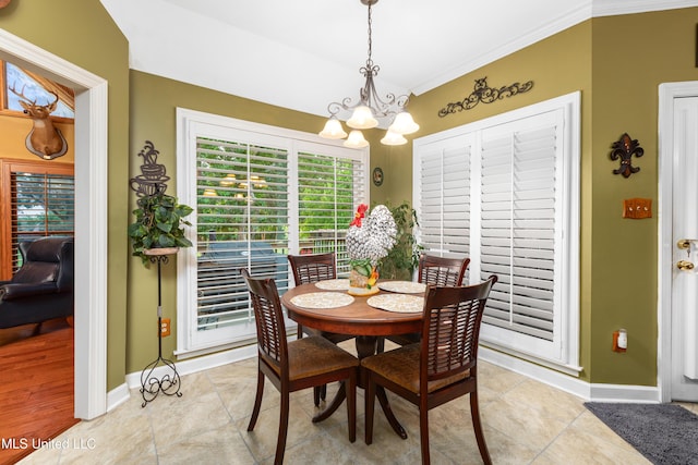 9194 Rosalie Cv, Olive Branch, MS 38654 - dining space with a chandelier and crown molding