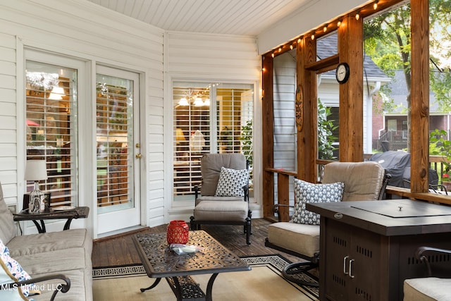 9194 Rosalie Cv, Olive Branch, MS 38654 - sunroom / solarium with hardwood / wood-style floors, wooden walls, crown molding, wooden ceiling, and a chandelier