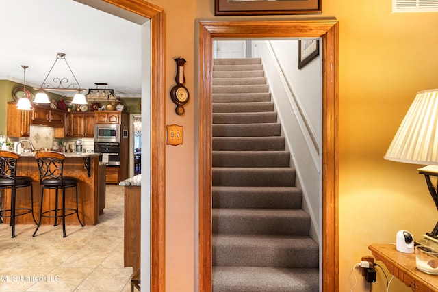 9194 Rosalie Cv, Olive Branch, MS 38654 - staircase featuring tile patterned flooring
