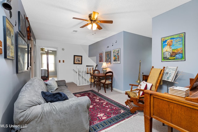 9194 Rosalie Cv, Olive Branch, MS 38654 - living area featuring ceiling fan, carpet floors, and a textured ceiling