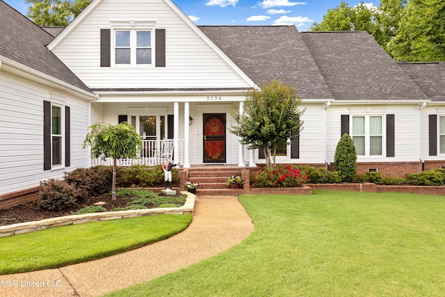 9194 Rosalie Cv, Olive Branch, MS 38654 - view of front facade with roof with shingles, covered porch, and a front yard