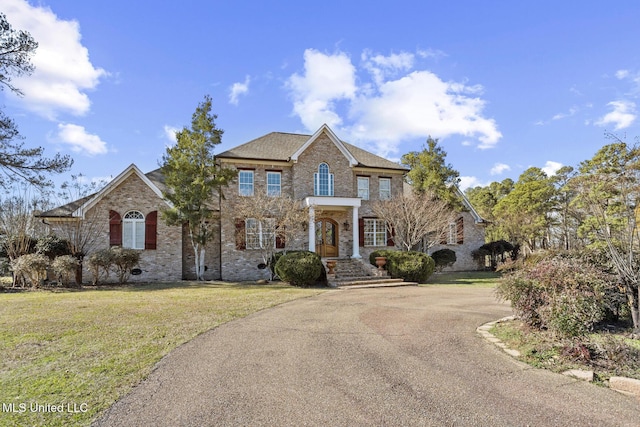 view of front of property with a front lawn