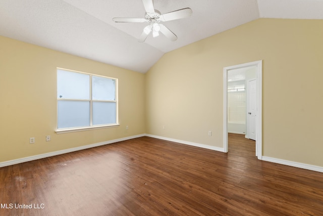 unfurnished room with ceiling fan, dark wood-type flooring, and lofted ceiling