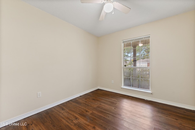 unfurnished room with dark hardwood / wood-style floors and ceiling fan