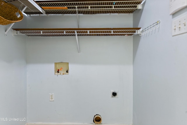 clothes washing area featuring hookup for an electric dryer and hookup for a washing machine