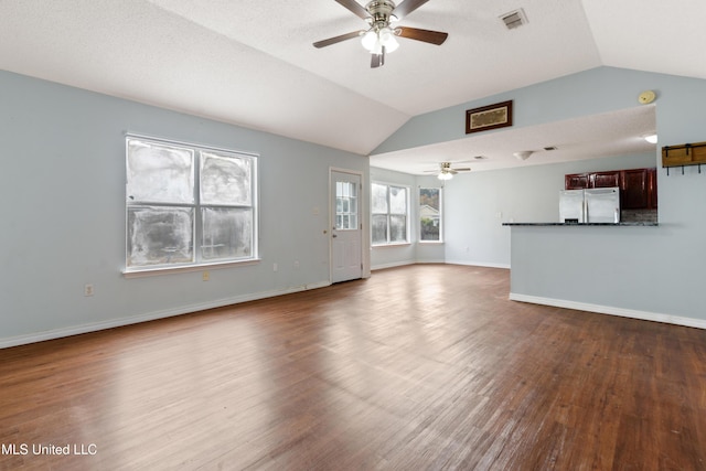 unfurnished living room with hardwood / wood-style flooring, ceiling fan, and lofted ceiling