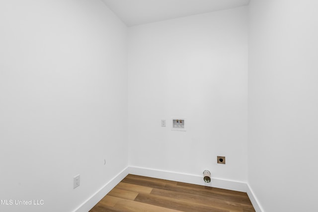 washroom featuring laundry area, hookup for an electric dryer, washer hookup, baseboards, and dark wood-style floors