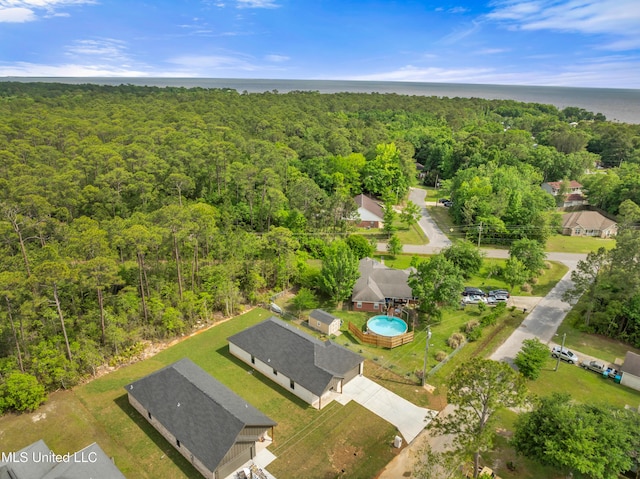 bird's eye view featuring a water view and a view of trees