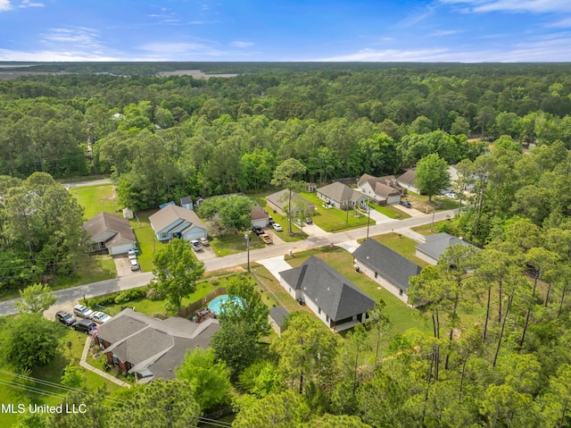 aerial view with a view of trees and a residential view