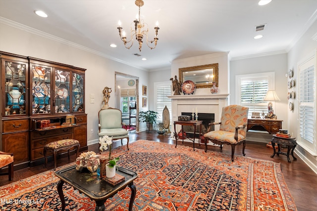 living area featuring visible vents, wood finished floors, recessed lighting, and a notable chandelier
