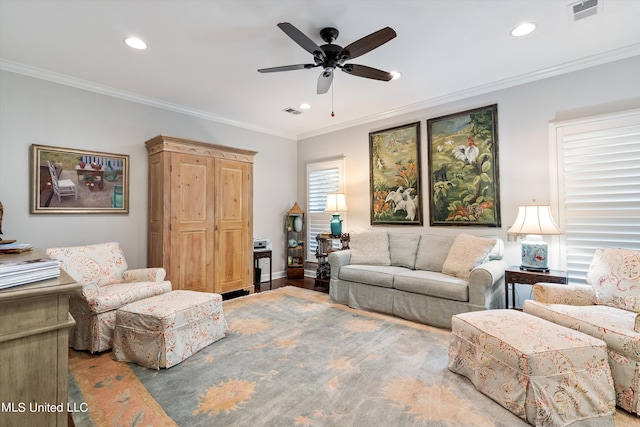 living room with ornamental molding, a ceiling fan, visible vents, and recessed lighting