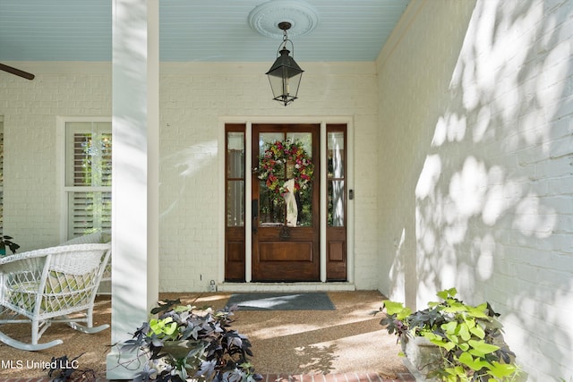 view of exterior entry with covered porch