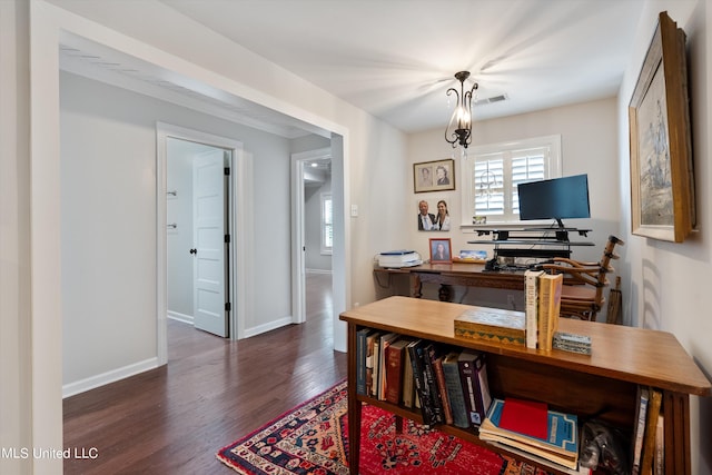 office space featuring wood finished floors, a wealth of natural light, and baseboards