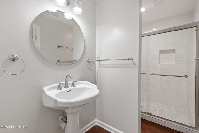 full bath with a shower stall and visible vents
