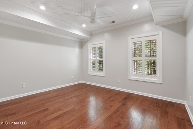 empty room featuring ceiling fan, baseboards, crown molding, and dark wood-type flooring