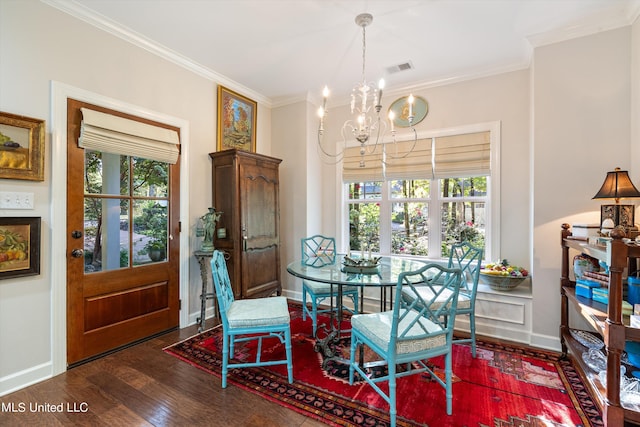 dining area with an inviting chandelier, wood finished floors, visible vents, ornamental molding, and baseboards