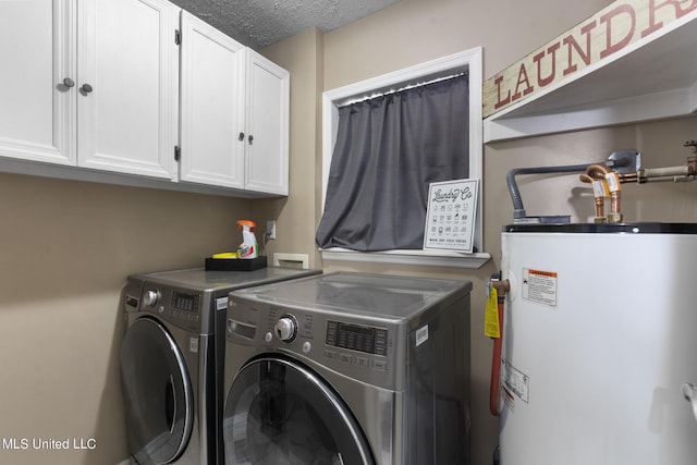 laundry area featuring cabinets, washer and dryer, a textured ceiling, and gas water heater