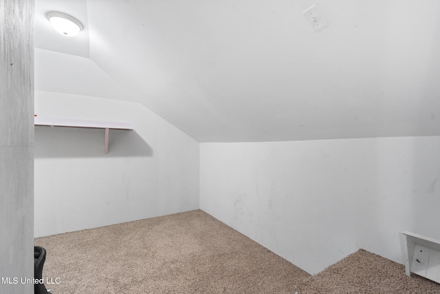 bonus room featuring lofted ceiling and carpet floors