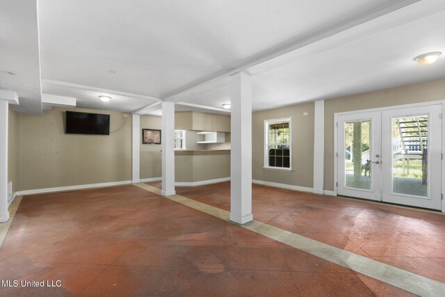 basement featuring tile patterned floors and french doors