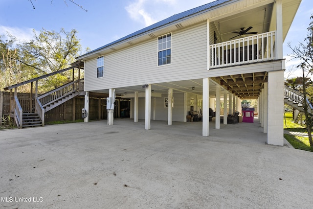 exterior space featuring a carport and ceiling fan