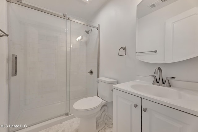 bathroom featuring toilet, a stall shower, visible vents, and vanity