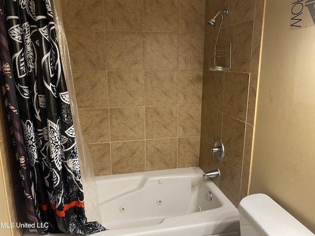 bathroom with toilet and shower / bath combo with shower curtain