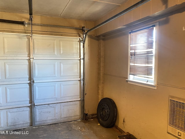 garage featuring heating unit