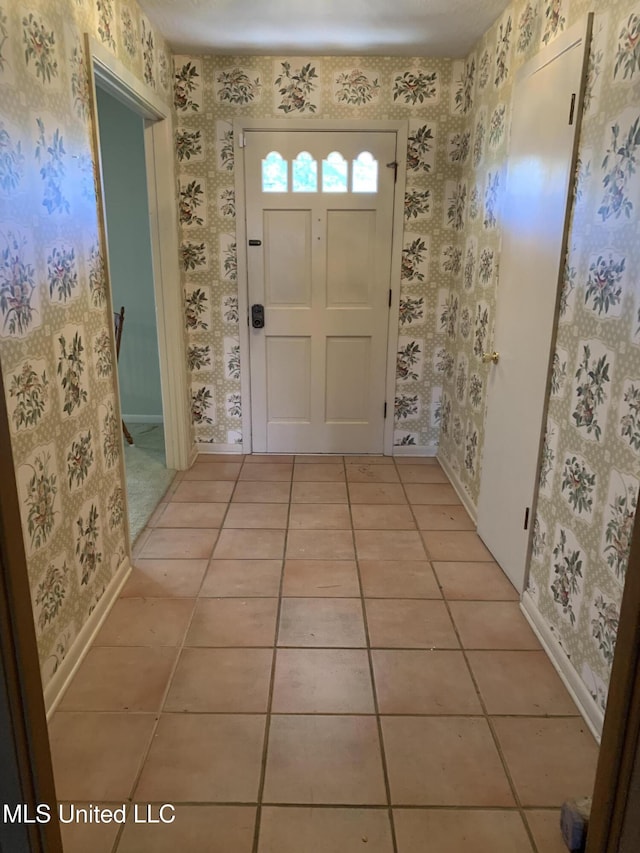 foyer entrance with light tile patterned flooring