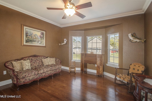 sitting room with dark hardwood / wood-style floors, ceiling fan, and crown molding