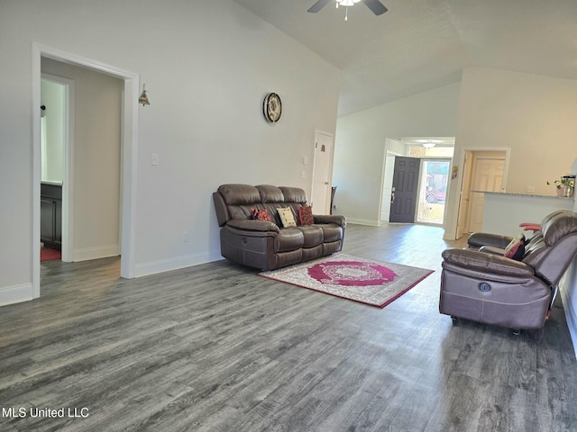 living room with dark hardwood / wood-style floors, high vaulted ceiling, and ceiling fan