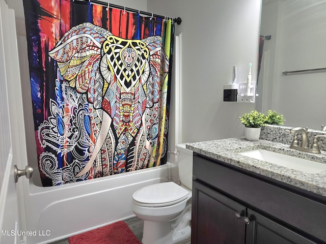 full bathroom with vanity, toilet, and shower / bath combo with shower curtain