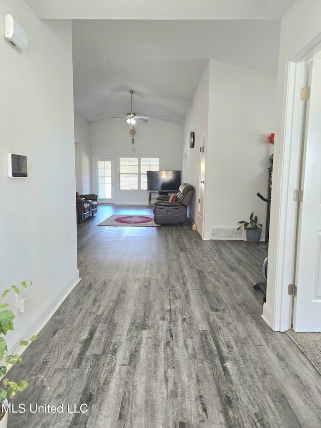 living room featuring ceiling fan, hardwood / wood-style floors, and lofted ceiling